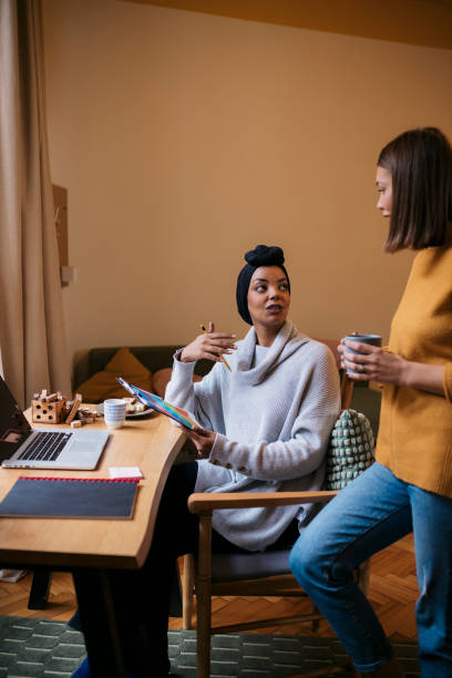 istock Two female friends discussing over a new startup project at home office 2149018332
