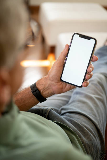 istock Sitting at home holding smartphone. 2149019977