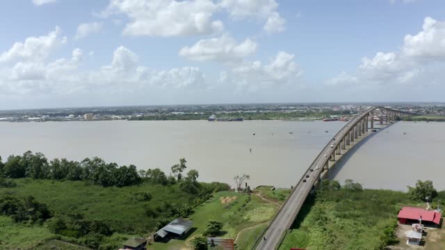 Drone view of Jules Wijdenbosch bridge captured with mavic 2 pro, orbiting around bridge, Suriname river in port of Paramaribo, capital of Suriname