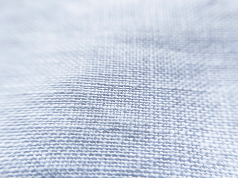 natural blue linen fabric close-up, selective focus