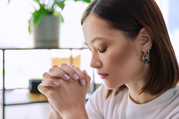 istock Excited sad upset young woman with folded hands, face in profile close-up 2149022909