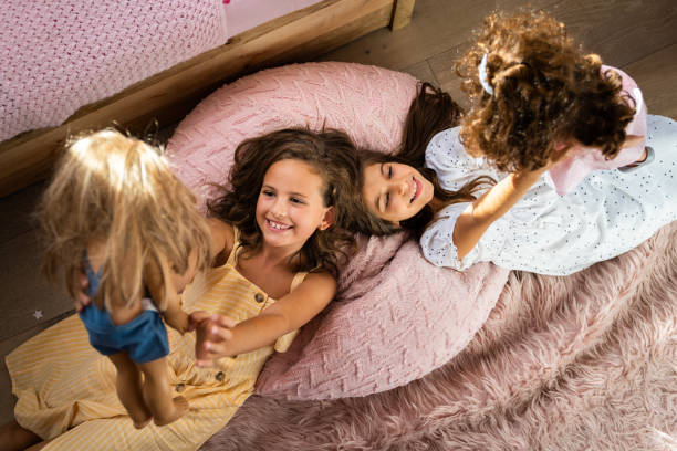 istock Playing with dolls photo from above 2149027842
