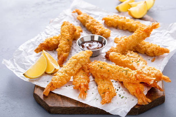 istock Cooked tempura shrimp on a serving board with dipping sauce 2149028297