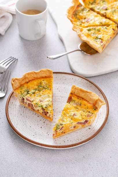 istock Homemade quiche with ham and cheese cut on the table 2149029601