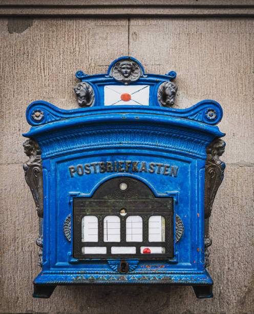 Old postbox on the house wall in Potsdam. Retro architecture element