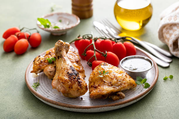 istock Roasted chicken thighs and drumsticks served with pesto sauce 2149030076