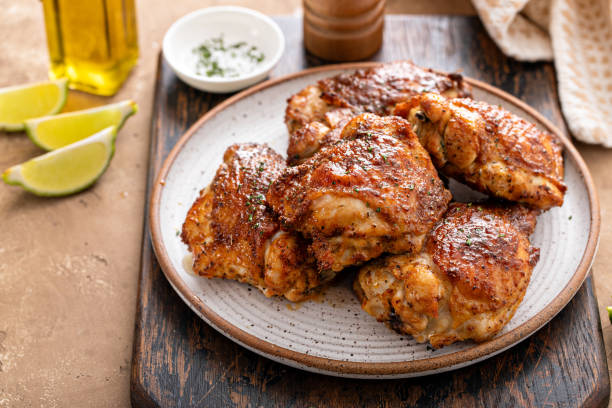 istock Chicken thighs roasted or air fried with paprika and lime 2149030173
