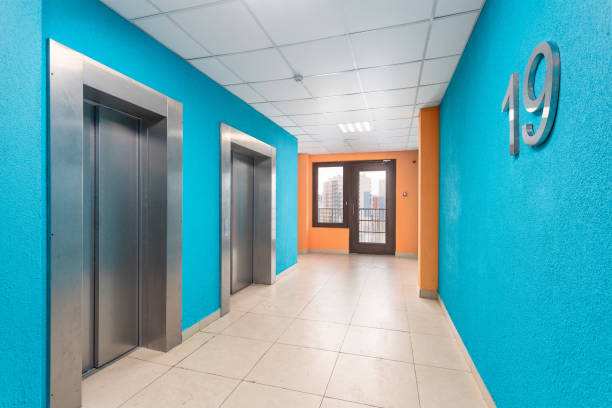 istock A bright corridor with elevators on the 19th floor, blue with orange details. 2149030236