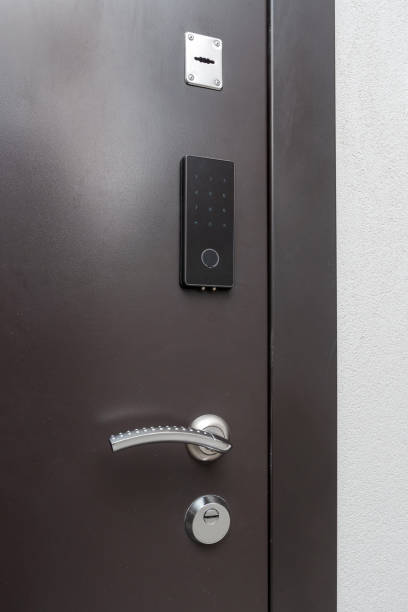 istock Modern entrance door with electronic code lock and door handle. 2149030269