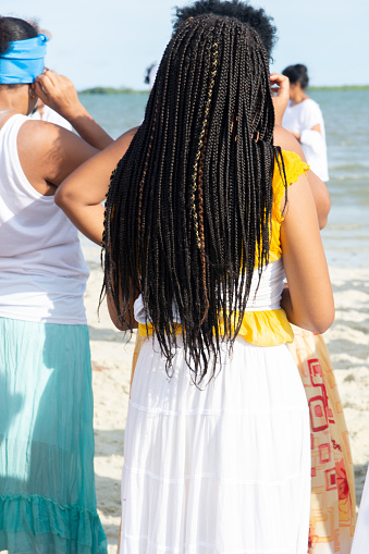 Santo Amaro, Bahia, Brazil - May 19, 2019: Members of Umbanda are participating in the tribute to Iemanja on Itapema beach in the city of Santo Amaro, Bahia.