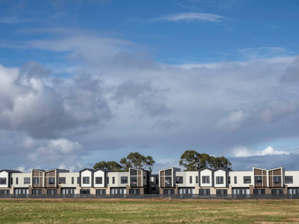 istock Terrace houses next to grass area 2149031995