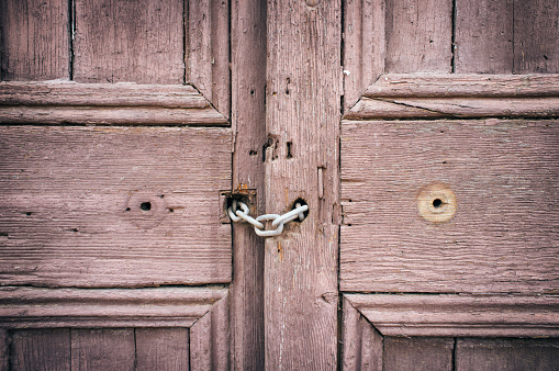 brass door knobs on wooden door of house