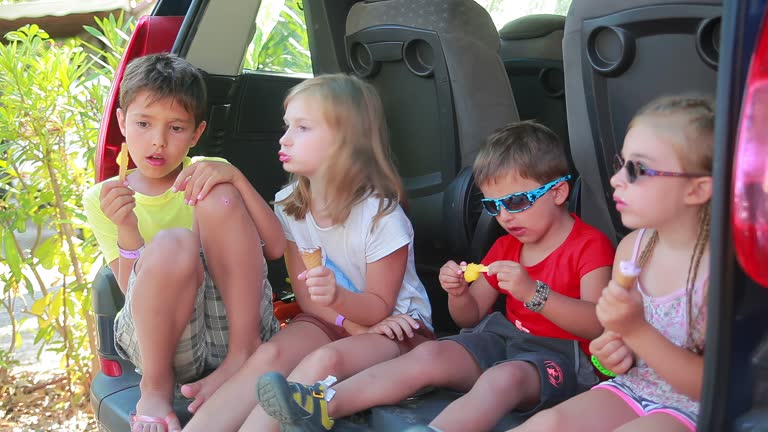 Cheerful children are eating delicious ice cream