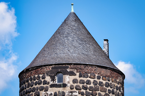 conical roof on a tower of the partially preserved medieval city wall of cologne