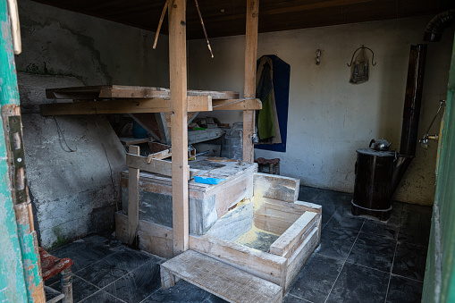 Interior view of a water mill for grinding wheat.