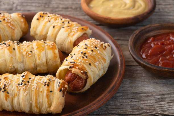 istock Homemade Sausage in dough rolls on plate 2149034993