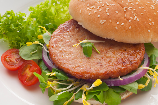 exquisite and flavorful turkey burger with fresh vegetables