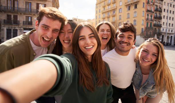 istock a group of young people are taking a selfie together 2149037029