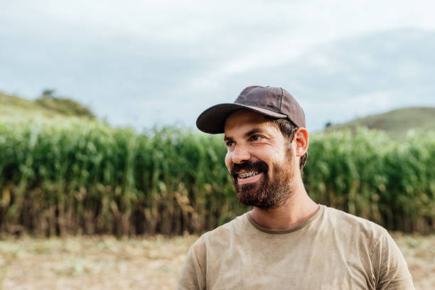 Young smiling farmer in the field