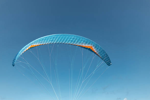 istock Colorful paraglider close-up against the blue sky 2149039345
