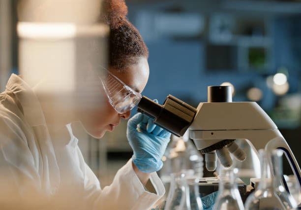 istock Experiment, microscope and sample with woman scientist in laboratory for breakthrough or research. Biology, innovation or science and medical engineer with test specimen in lab for clinical study 2149039460