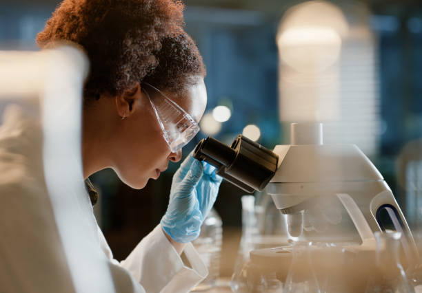 istock DNA, microscope and sample with woman scientist in laboratory for breakthrough or research. Biotechnology, innovation or science and medical engineer with test specimen in lab for clinical study 2149039461