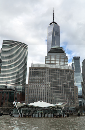brookfield place ferry terminal on the hudson river in downtown manhattan with nyc skyline skycraper buildings in the background (boat transport stop) new jersey access new york city waterway harbor