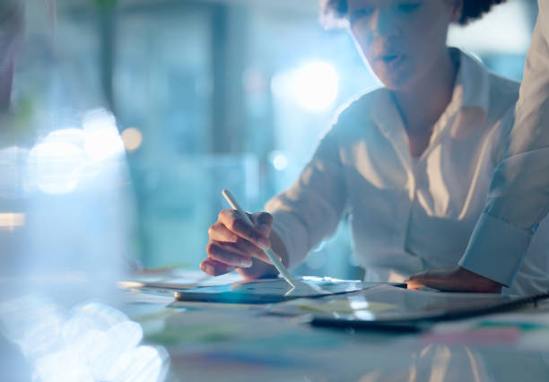 istock People, tablet and hand with desk in team for work with design, planning and research with tech in company. Digital, notebook and feedback with review for business growth with schedule for job 2149040009