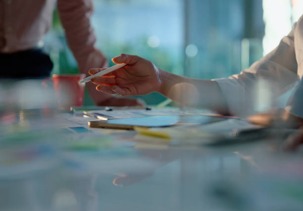 istock Hand, pen and writing on documents for notes, planning or idea for work in business meeting with contract. Paper, stationery and people for agenda in office, workspace or at desk in conference room 2149040011