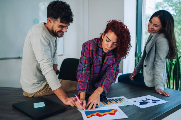 istock Happy multiracial coworkers have fun working together at office brainstorming 2149040899