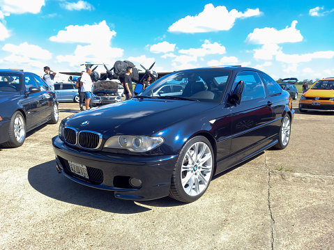 Morón, Argentina - Apr 7, 2024: Old shiny 2000s BMW 3 Series E46 sedan at a classic car show in an airfield.