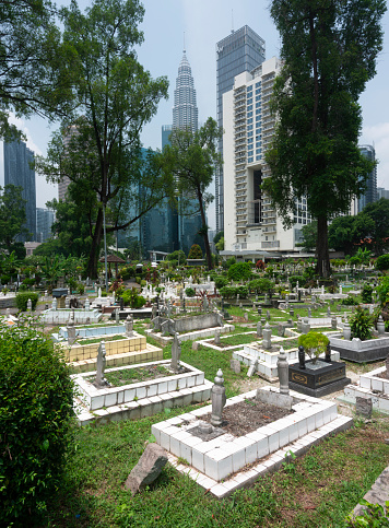 Kuala Lumpur,Malaysia-April 16 2023:Tucked away off Jln Ampang and split from Kampung Baru by a highway is one of KL's oldest Muslim burial grounds. It's shaded by giant banyans and rain trees.