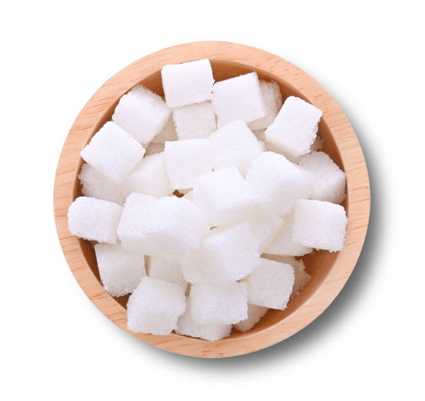 istock sugar cubes in wooden bowl on white background 2149050289