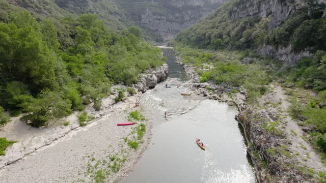 Kids On Canoe At Ardeche Nature Protected Reserve Enjoying A Vacation Day
