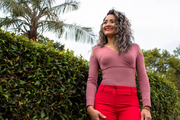 istock Beautiful young woman posing in a public park 2149050842