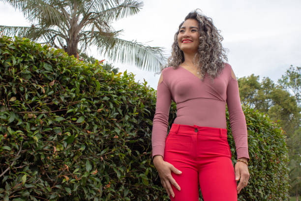 istock Beautiful young woman posing in a public park 2149050874
