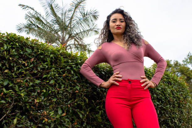 istock Beautiful young woman posing in a public park 2149050934