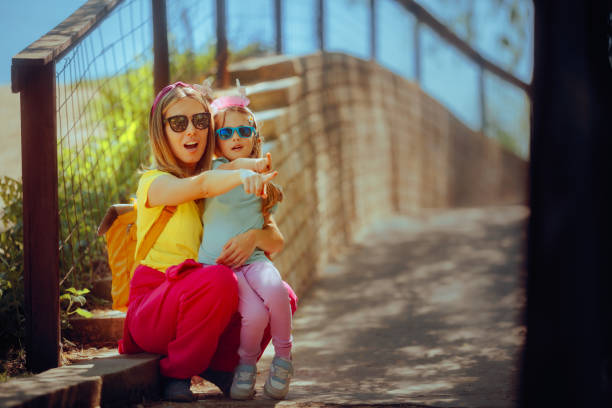 istock Mother and Daughter Seeing Something in the Distance 2149051280