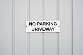 No Parking sign on a garage door