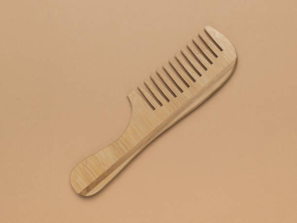 istock Wooden comb on a light beige background. 2149051730