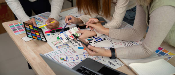 istock Brainstorm team of creative web graphic designer planning, Group of mobile phone app developer team meeting for share ideas about screen prototype layout for smartphone. startup planning ui and ux 2149053638