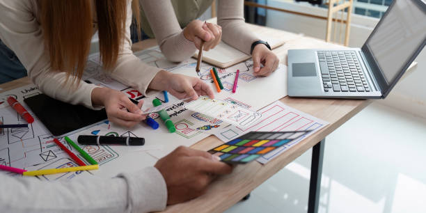 istock Brainstorm team of creative web graphic designer planning, Group of mobile phone app developer team meeting for share ideas about screen prototype layout for smartphone. startup planning ui and ux 2149053659