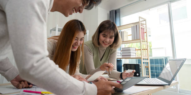 istock Brainstorm team of creative web graphic designer planning. Creative designers present ux ui to team. Designers team working meeting in office 2149053665