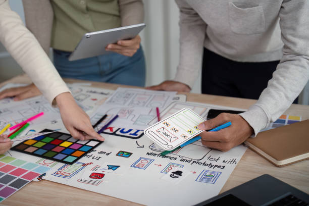 istock Brainstorm team of creative web graphic designer planning, Group of mobile phone app developer team meeting for share ideas about screen prototype layout for smartphone. startup planning ui and ux 2149053681