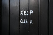 Keep clear sign on a black garage door