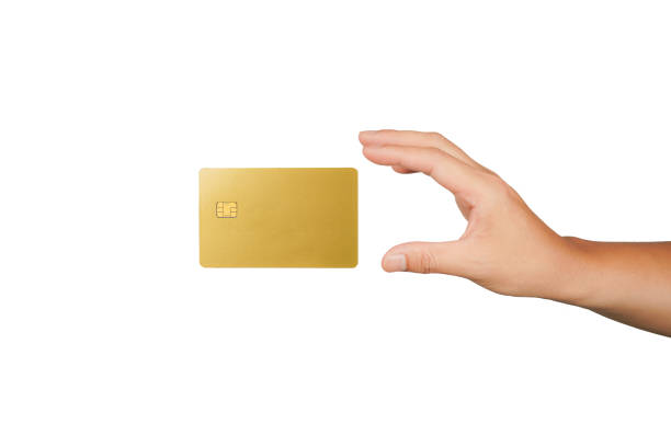 male hand holding floating gold Bank credit Card mockup template on isolated background