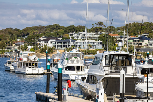 Moored motorboats at marina, Sydney Australia, background with copy space, full frame horizontal composition
