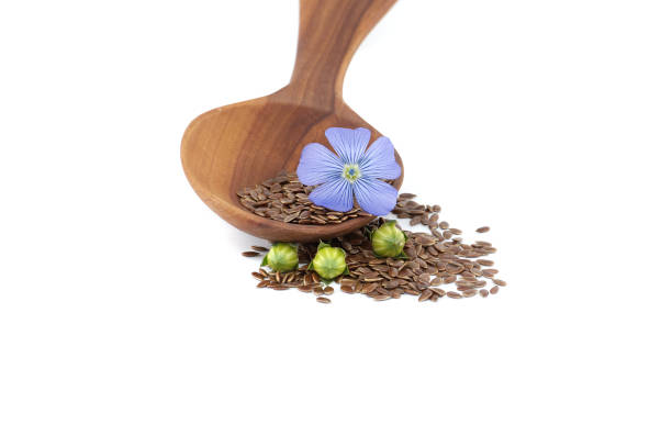 istock Flax blossom and heap of linseed isolated on white 2149054676