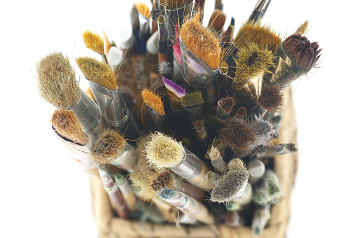 Brush collection vary in size, colors and possibly materials, condition of the brushes the cleanliness of which may vary, top view