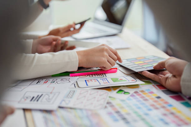 istock UI designer and UX developer brainstorm idea to design the application appearance in the early stage. Creative digital development agency. UX UI concept 2149059105